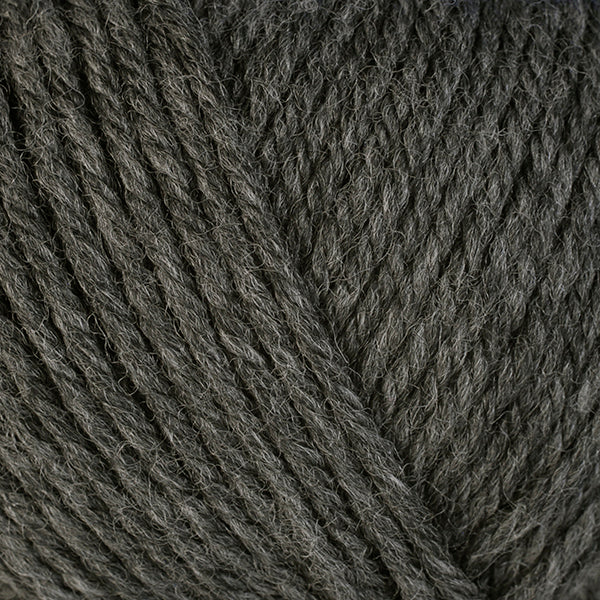 A close-up image of a skein of Berroco Ultra Wool bulky weight yarn in a heathered charcoal gray color.