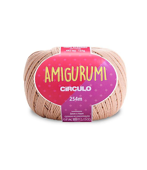 A skein of Circulo brand beige amigurumi cotton yarn with label showing the brand name and yardage.