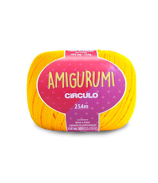 A skein of Circulo brand yellow amigurumi cotton yarn with label showing the brand name and yardage.