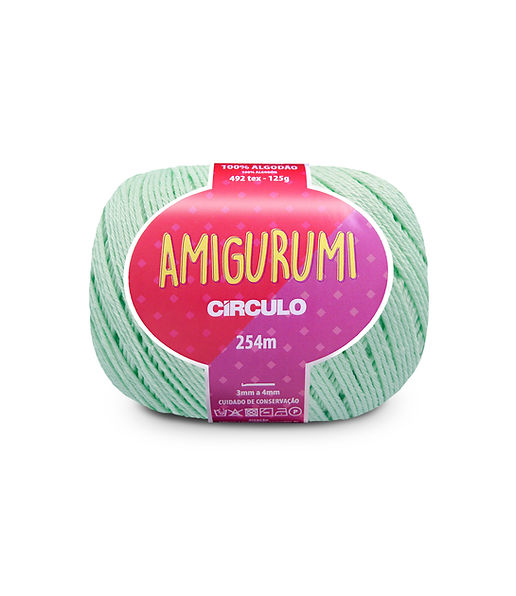 A skein of Circulo brand mint green amigurumi cotton yarn with label showing the brand name and yardage.