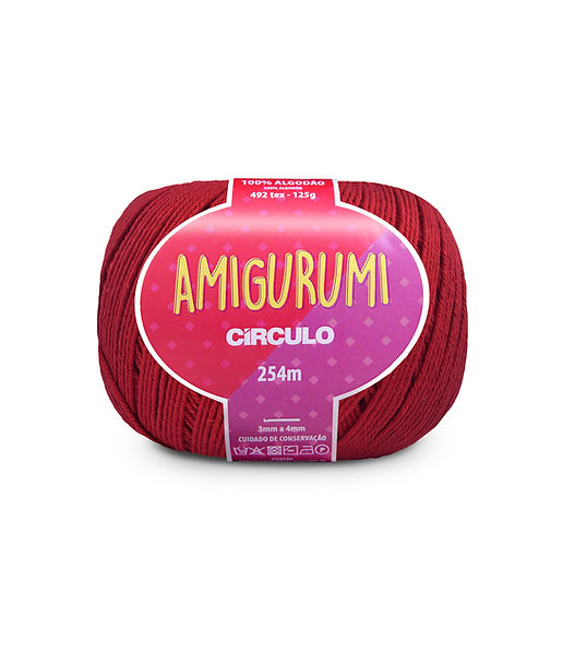 A skein of Circulo brand red amigurumi cotton yarn with label showing the brand name and yardage.