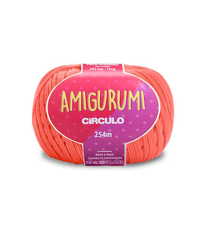 A skein of Circulo brand orange amigurumi cotton yarn with label showing the brand name and yardage.