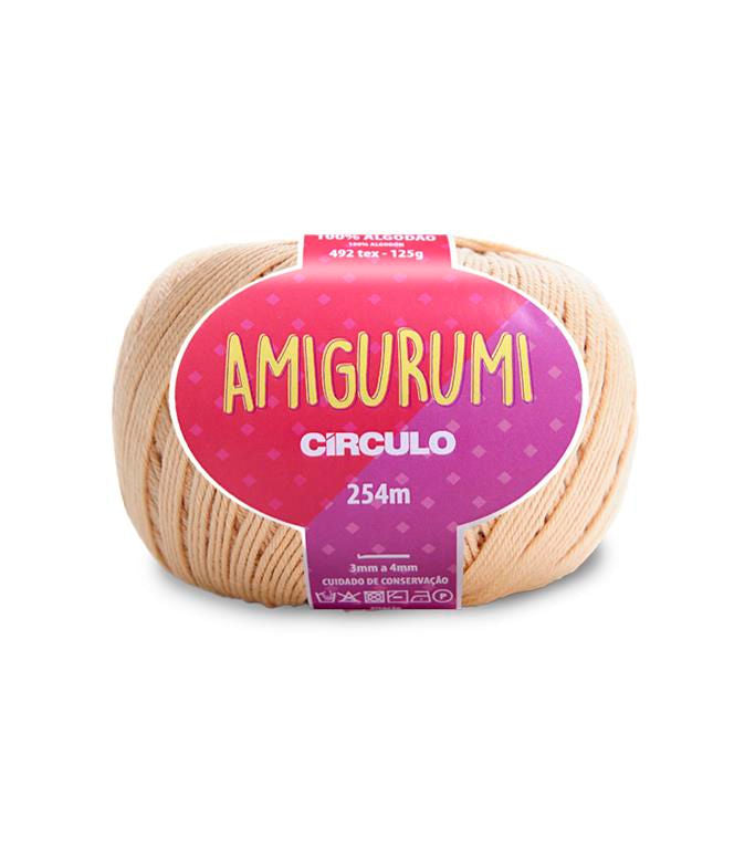 A skein of Circulo brand ivory amigurumi cotton yarn with label showing the brand name and yardage.