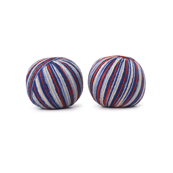 An image of two balls of Circulo Let it Sock sport weight yarn in the colors light blue, navy blue, red and gray against a white background.