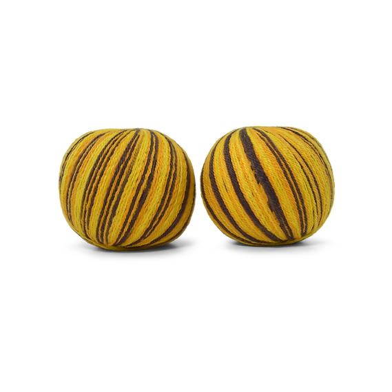 An image of two balls of Circulo Let it Sock sport weight yarn in the colors brown and yellow against a white background.