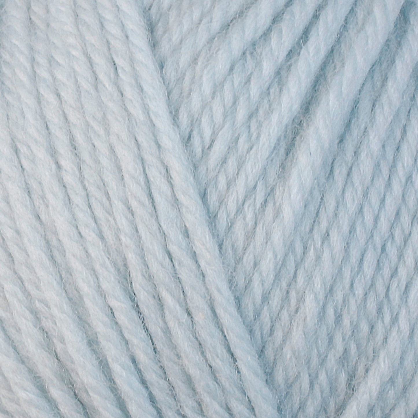 A close-up image of a skein of Berroco Ultra Wool bulky weight yarn in a pale blue color.