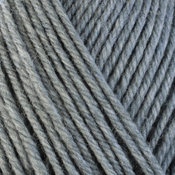 A close-up image of a skein of Berroco Ultra Wool bulky weight yarn in a heathered gray color.