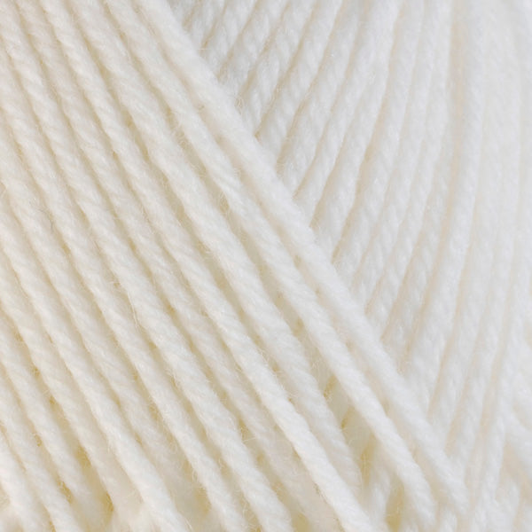 A close-up image of a skein of Berroco Ultra Wool bulky weight yarn in a solid white color.