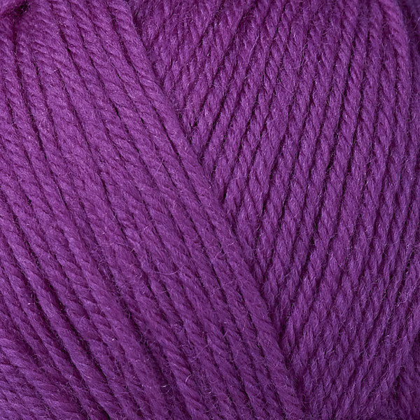 A close-up image of a skein of Berroco Ultra Wool worsted weight yarn in a solid royal purple color.