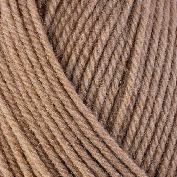 A close-up image of a skein of Berroco Ultra Wool worsted weight yarn in a heathered tan color.