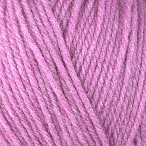 A close-up image of a skein of Berroco Ultra Wool worsted weight yarn in a heathered light pink color.
