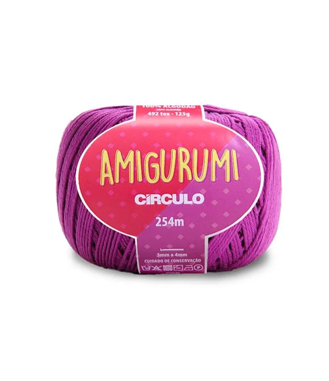 A skein of Circulo brand pink lavender amigurumi cotton yarn with label showing the brand name and yardage.