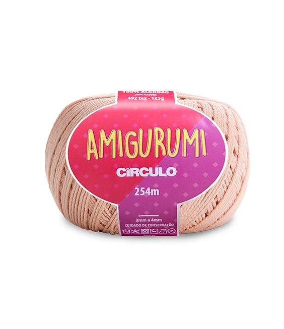 A skein of Circulo brand beige amigurumi cotton yarn with label showing the brand name and yardage.