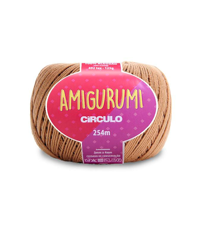 A skein of Circulo brand tan amigurumi cotton yarn with label showing the brand name and yardage.