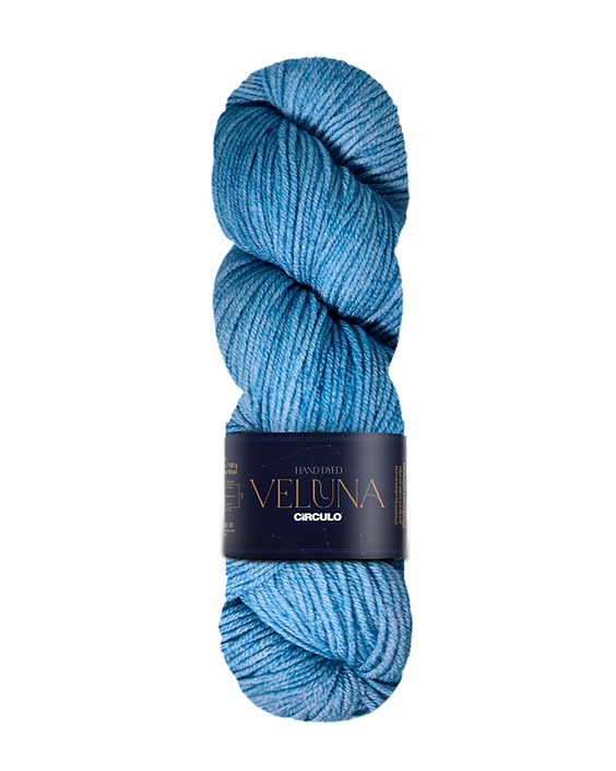 Light blue skein of yarn with a label on a white background