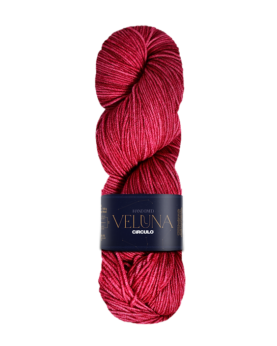 Red skein of yarn with a label on a white background