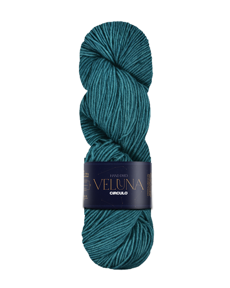 Teal skein of yarn with a label on a white background