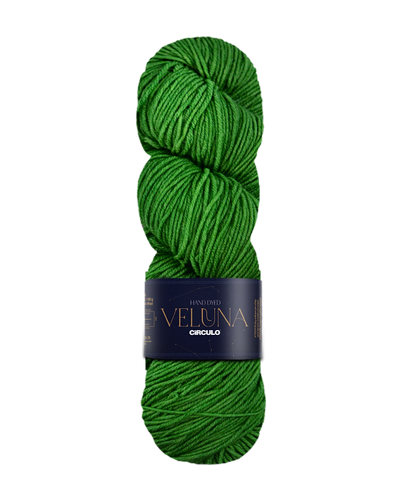Bright green skein of yarn with a label on a white background
