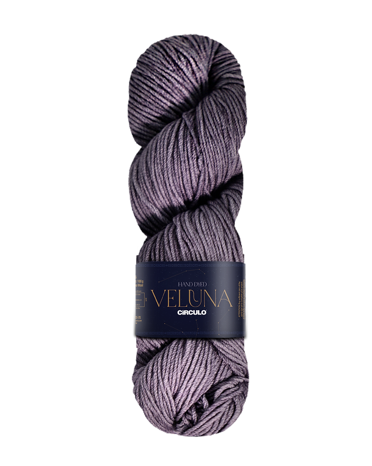 Skein of warm gray yarn with a label on a white background