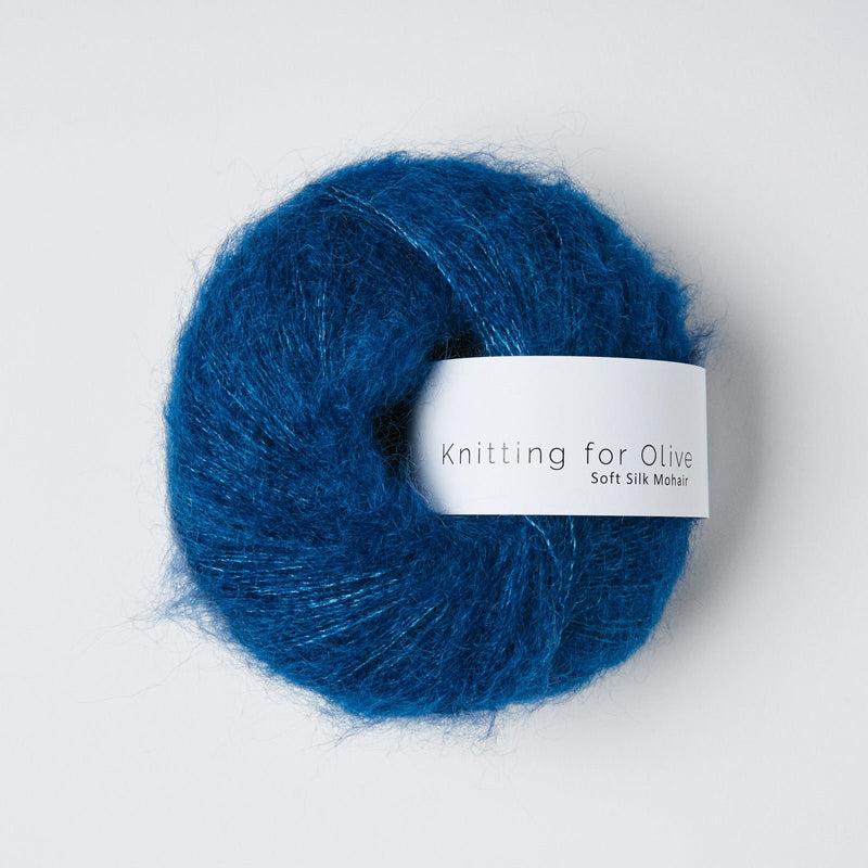 Blue yarn skein with 'Knitting for Olive' label on a white background