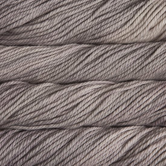 Close-up of warm light gray yarn strands