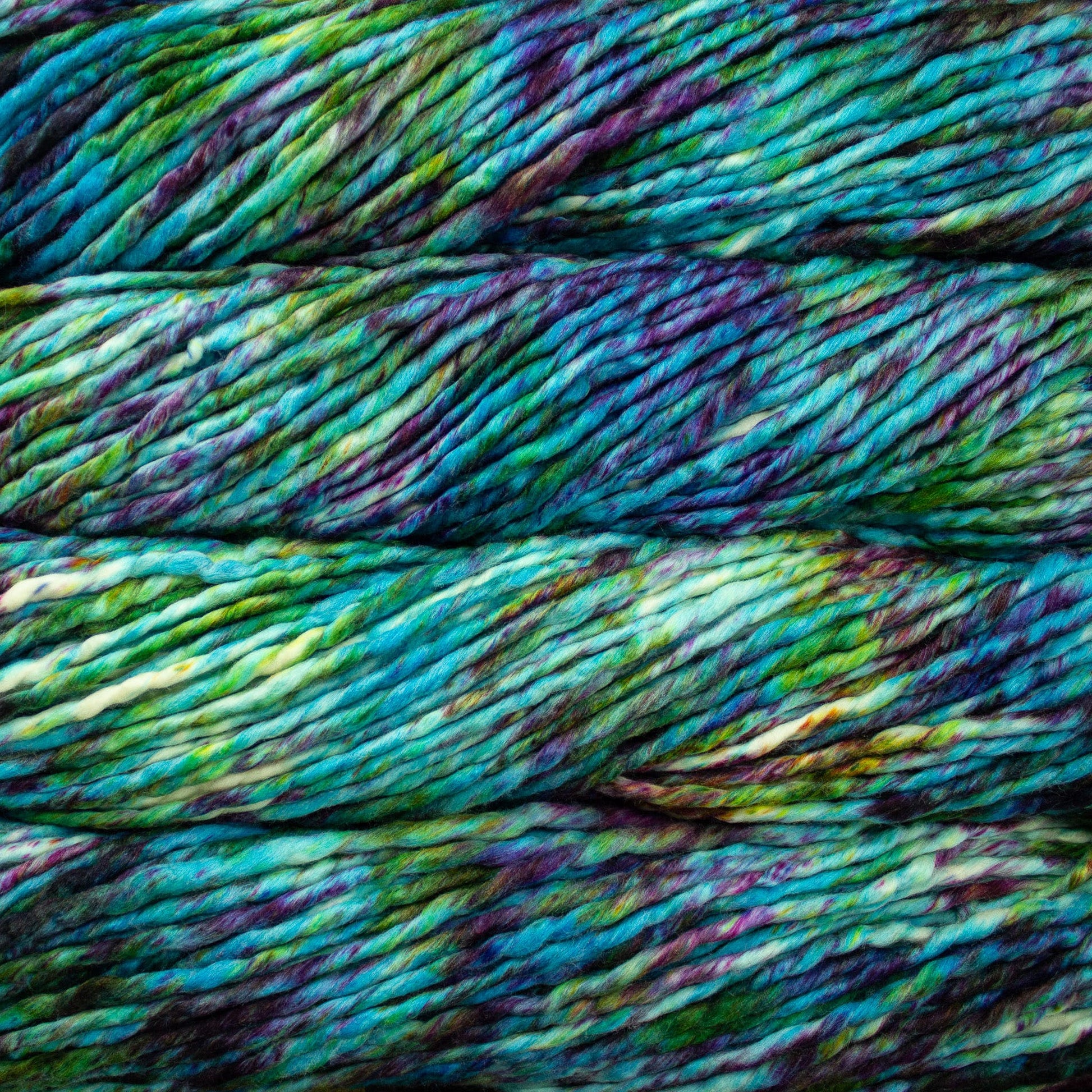 A close-up image of skeins of Malabrigo Rasta yarn in shades of green, blue, and purple, displaying the texture and color variation.