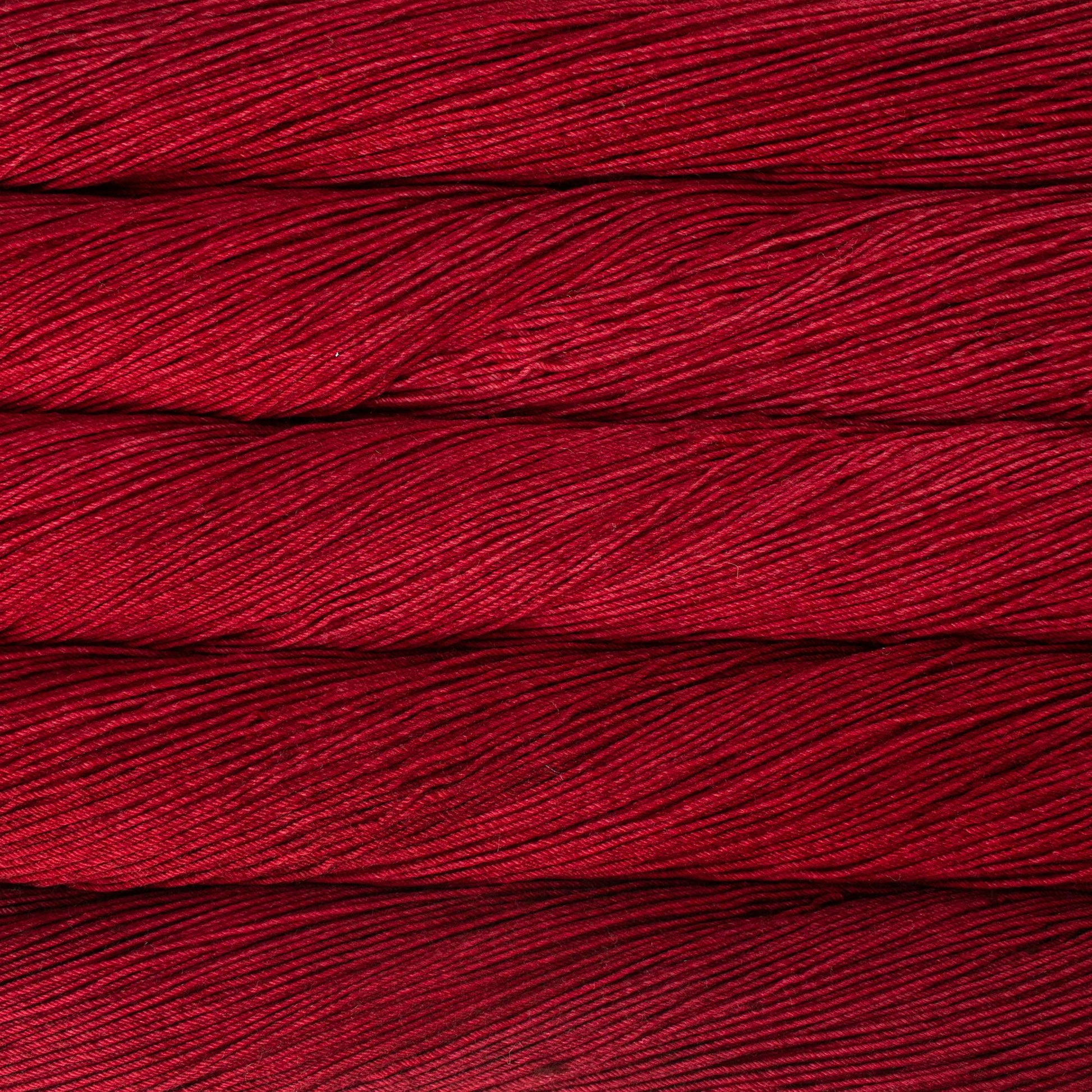 Close-up of red Malabrigo Ultimate sock yarn.