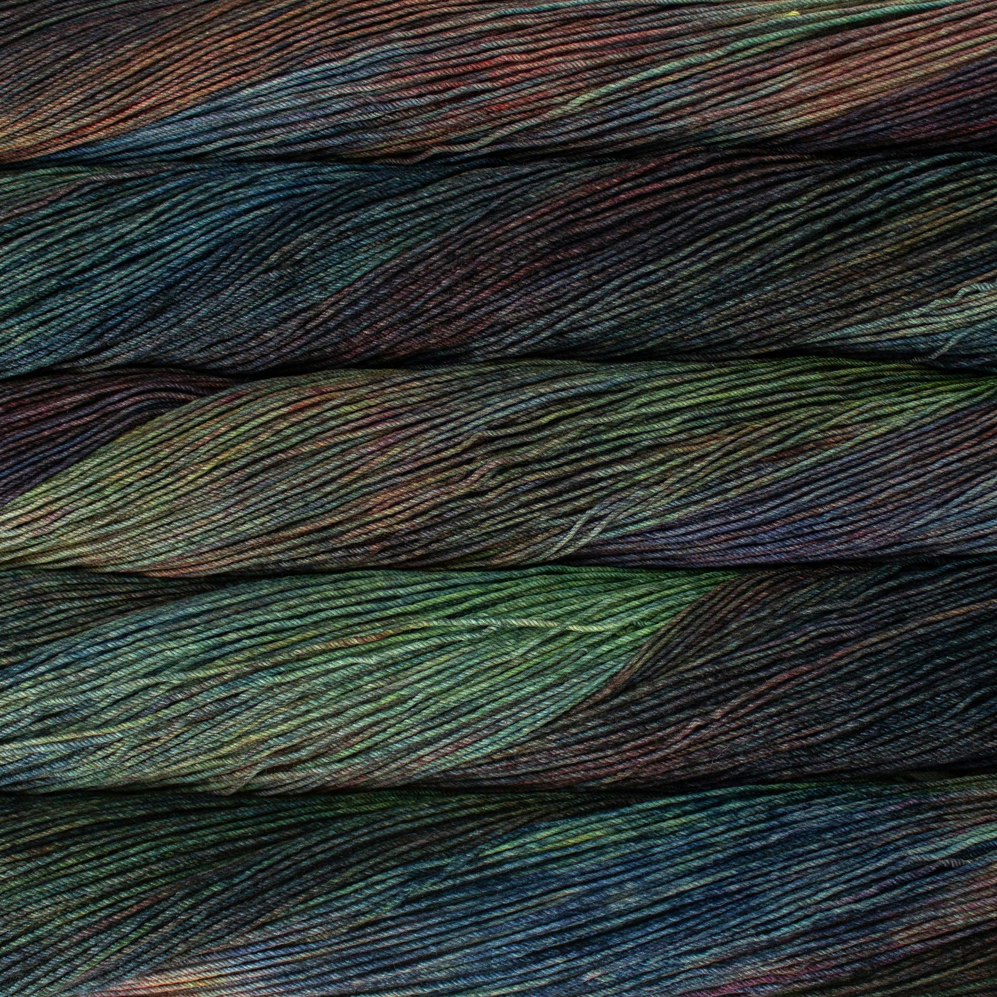 Close up of multiple multicolored skeins of yarn