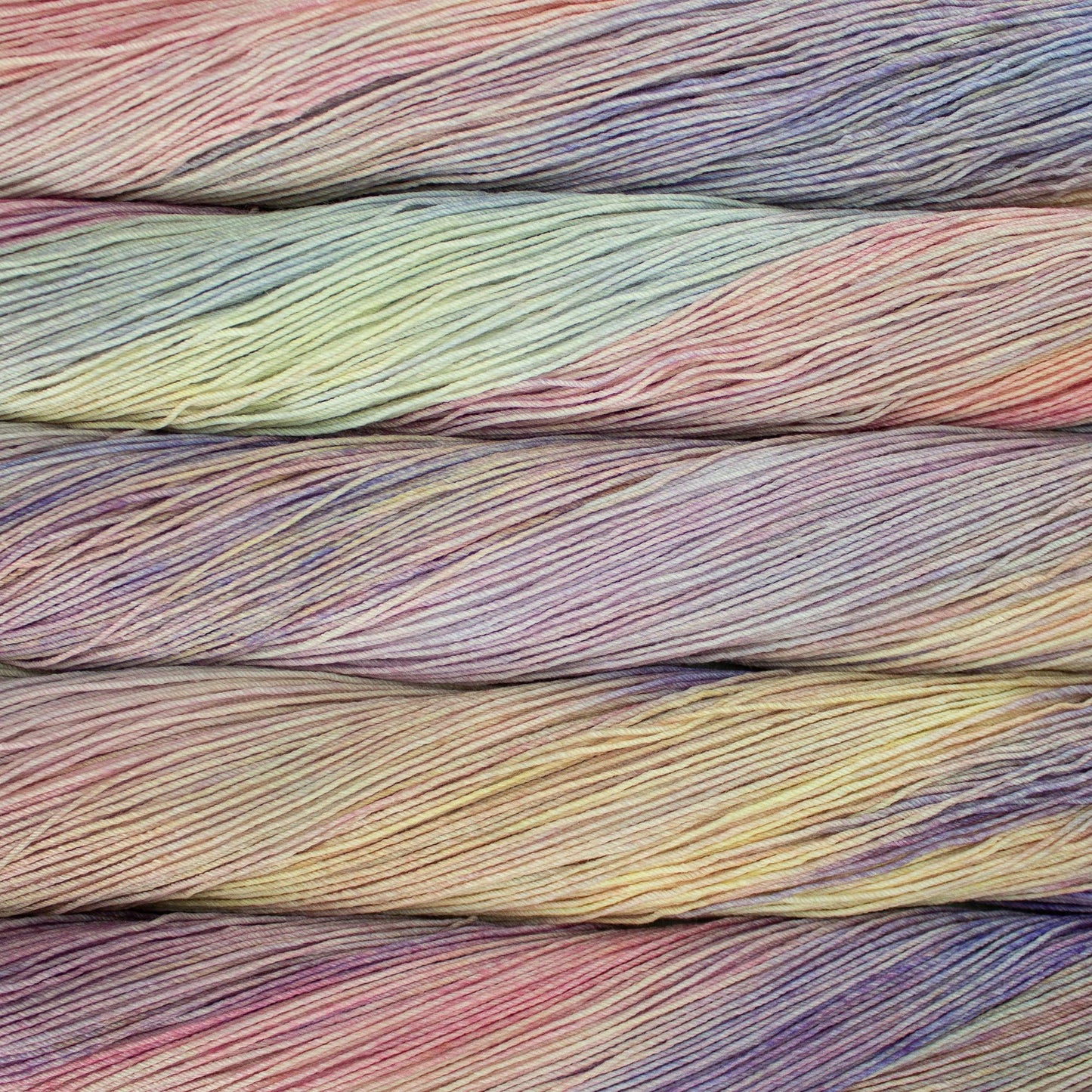 Close-up of multicolored yarn skeins in light pink, light blue, light purple, light yellow