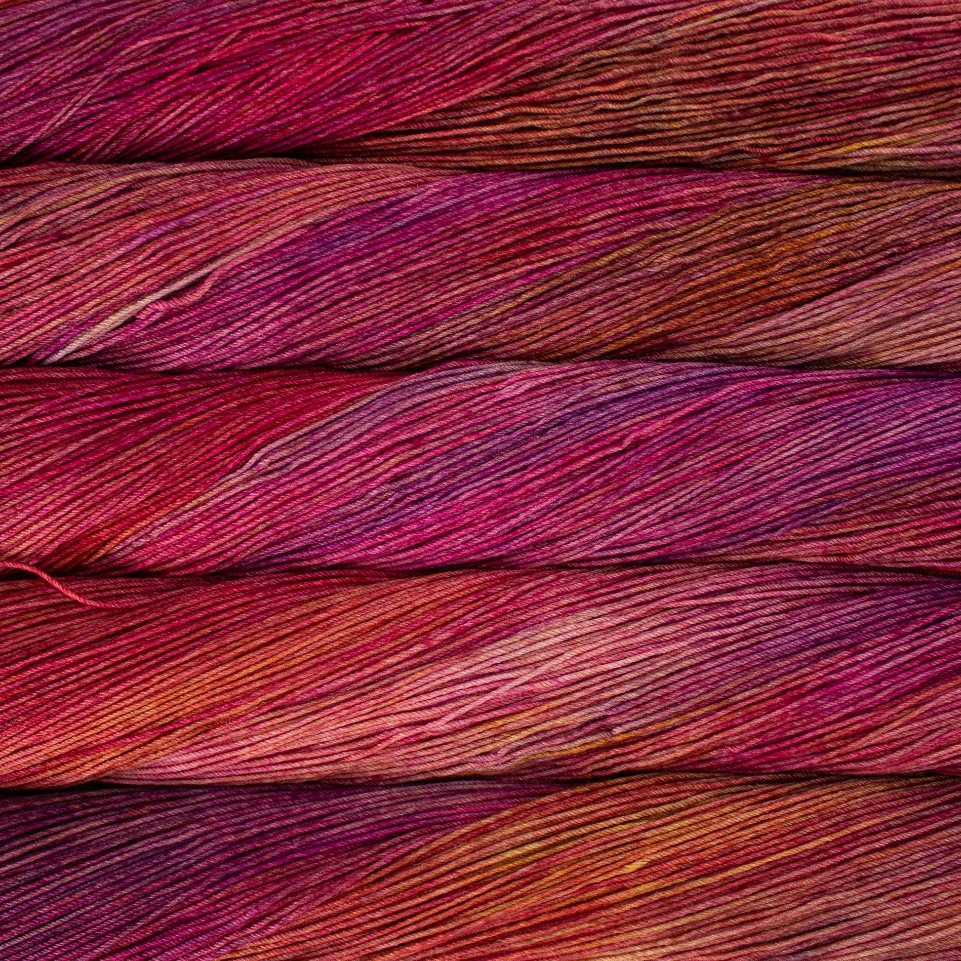 Close-up of pink and red yarn strands