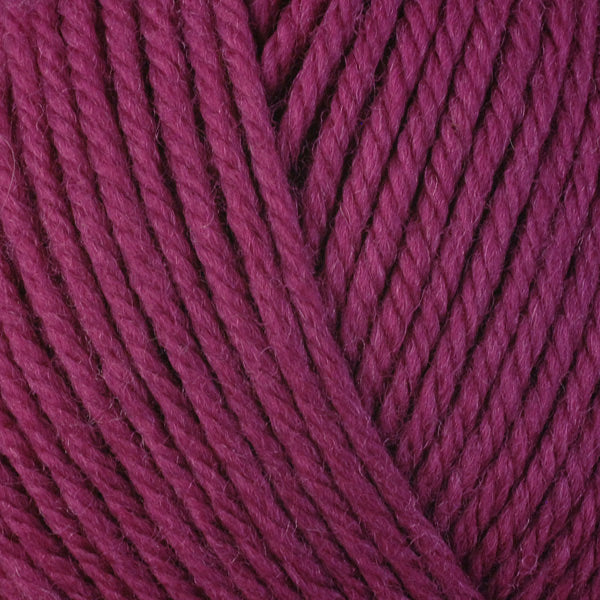 A close-up image of a skein of Berroco Ultra Wool worsted weight yarn in a solid deep magenta color.