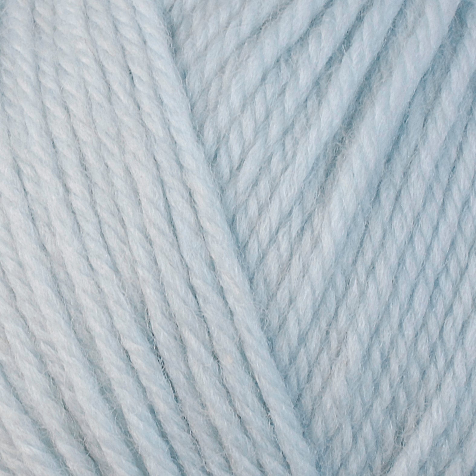 A close-up image of a skein of Berroco Ultra Wool bulky weight yarn in a pale blue color.