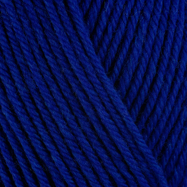 A close-up image of a skein of Berroco Ultra Wool worsted weight yarn in a solid deep blue color.