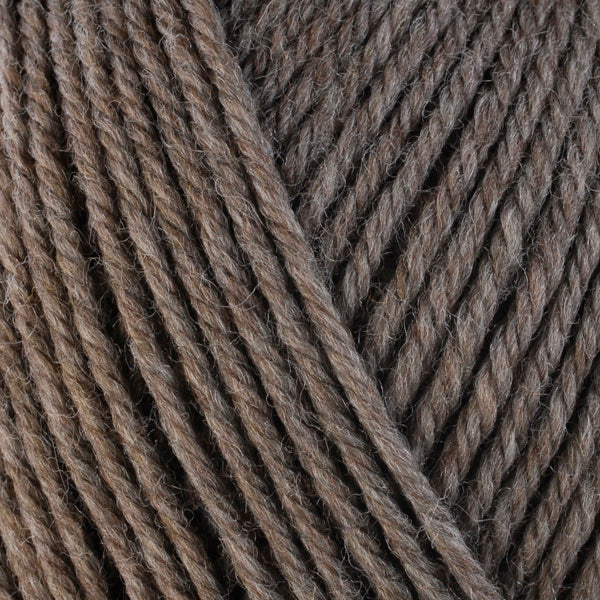 A close-up image of a skein of Berroco Ultra Wool worsted weight yarn in a heathered brown color.