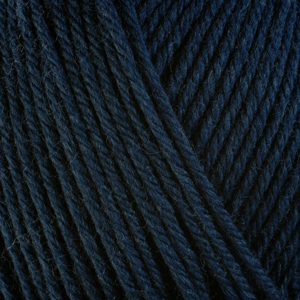 A close-up image of a skein of Berroco Ultra Wool worsted weight yarn in a heathered navy blue color.