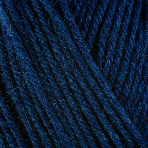 A close-up image of a skein of Berroco Ultra Wool worsted weight yarn in a heathered deep navy blue color.