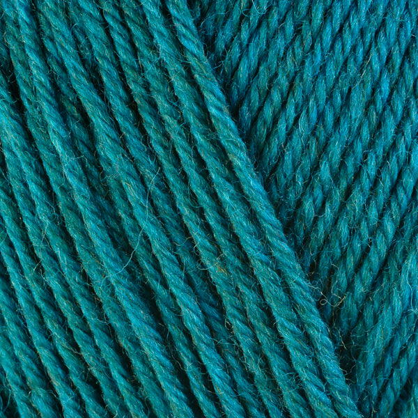 A close-up image of a skein of Berroco Ultra Wool worsted weight yarn in a  heathered teal color.