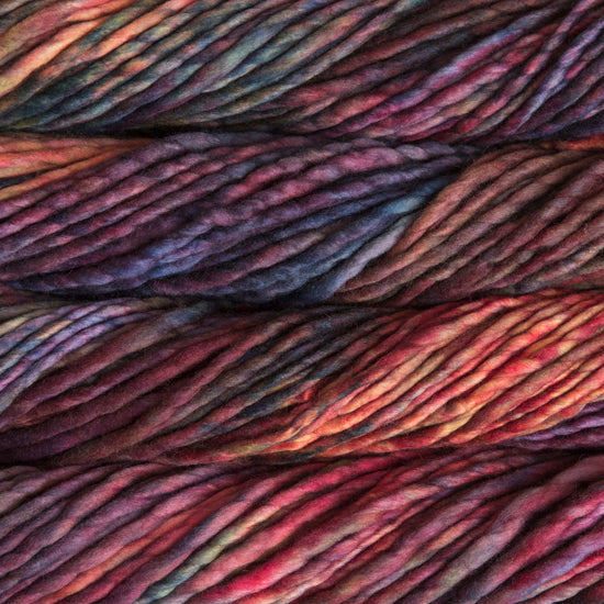 A close-up image of skeins of Malabrigo Rasta yarn in a rainbow of colors, displaying the texture and color variation.