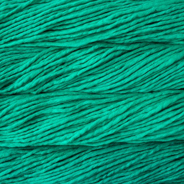 A close-up image of skeins of Malabrigo Rasta yarn in bright green, displaying the texture and color variation.