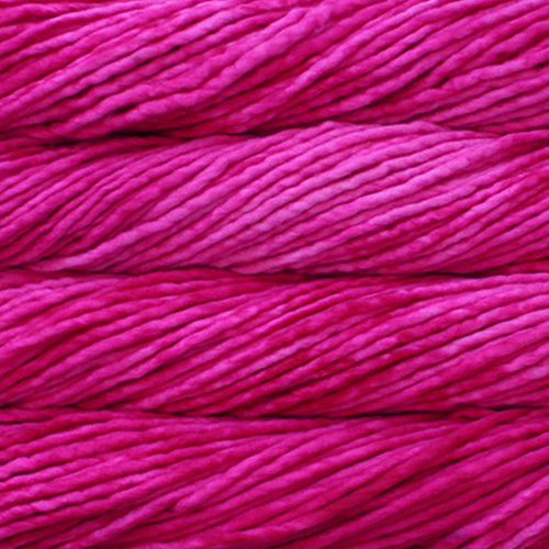 A close-up image of skeins of Malabrigo Rasta yarn in bright pink, displaying the texture and color variation.