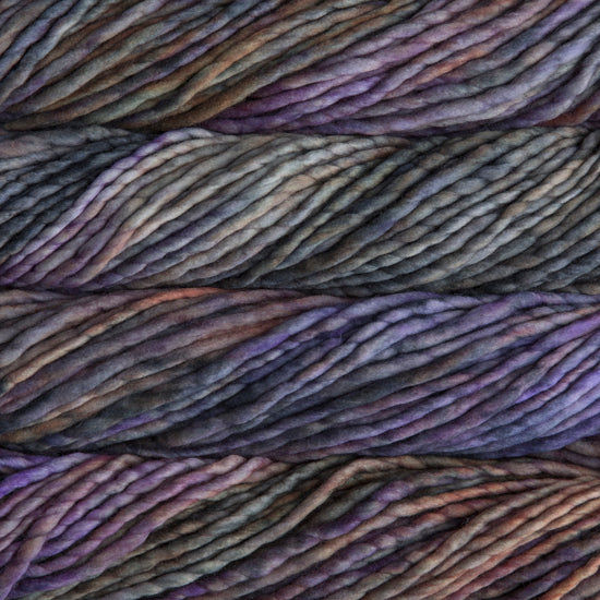 A close-up image of skeins of Malabrigo Rasta yarn in shades of purple, gray, and orange, displaying the texture and color variation.