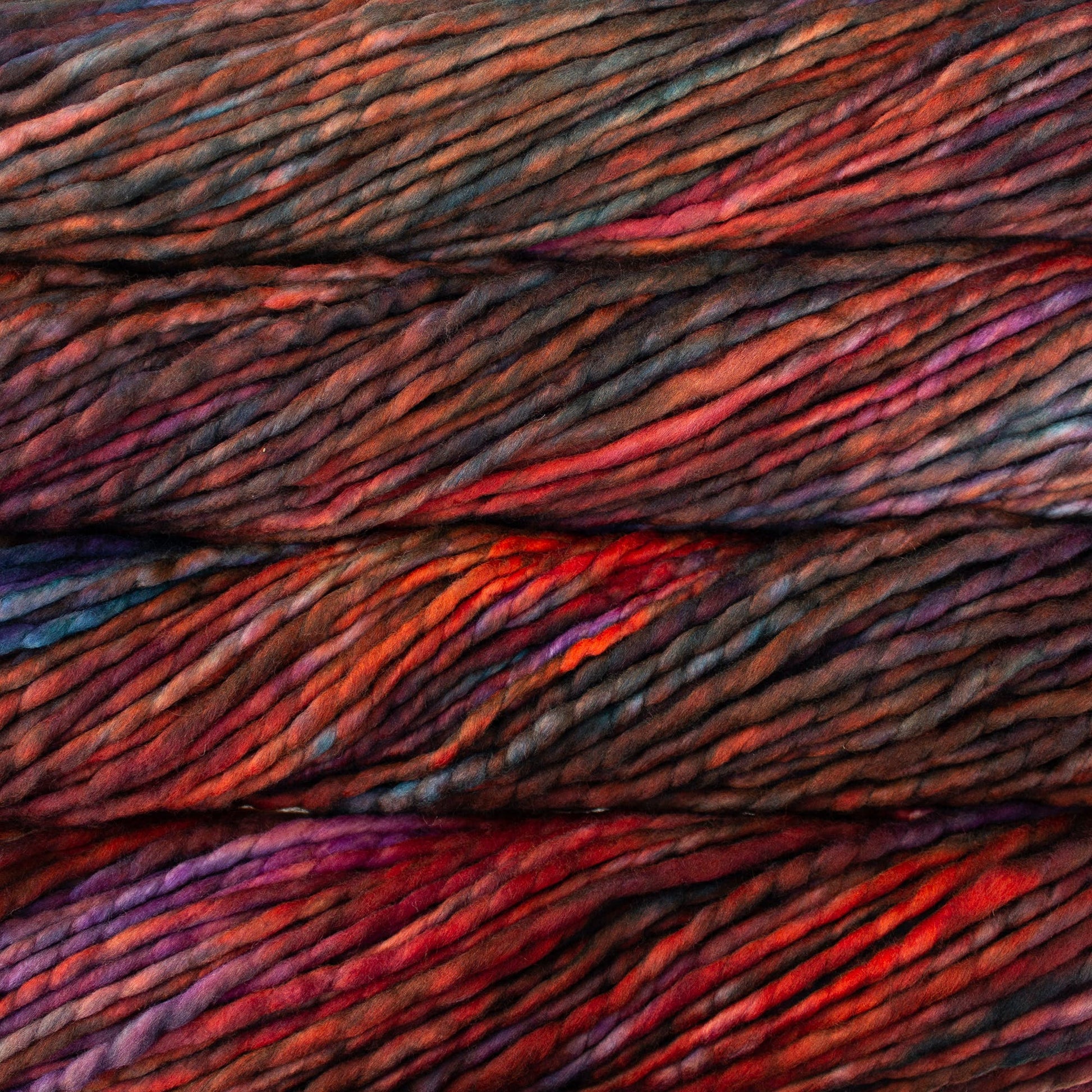 A close-up image of skeins of Malabrigo Rasta yarn in brown, blue, purple, and orange, displaying the texture and color variation.
