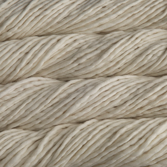 A close-up image of skeins of Malabrigo Rasta yarn in the natural off-white color, displaying the texture.