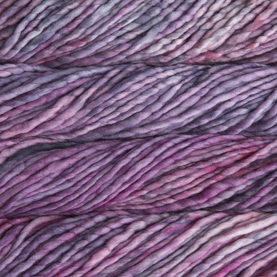 A close-up image of skeins of Malabrigo Rasta yarn in pale purple and magenta shades, displaying the texture and color variation.