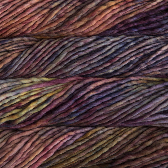 A close-up image of skeins of Malabrigo Rasta yarn in yellow, orange, and purple shades, displaying the texture and color variation.