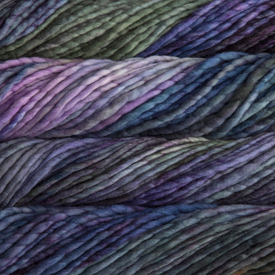 A close-up image of skeins of Malabrigo Rasta yarn in blue, green, and purple shades, displaying the texture and color variation.